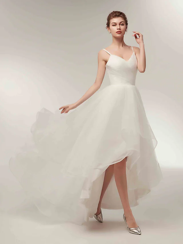 Detail of the side-draped design on the A-line white tulle dress.