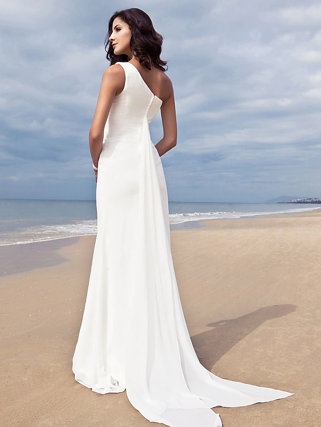 Back view of a simple one shoulder chiffon wedding dress.