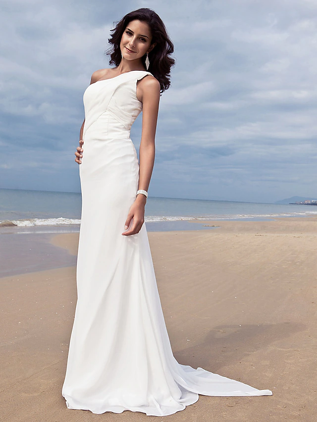 Full length view of a plus size bridal gown with one shoulder design.