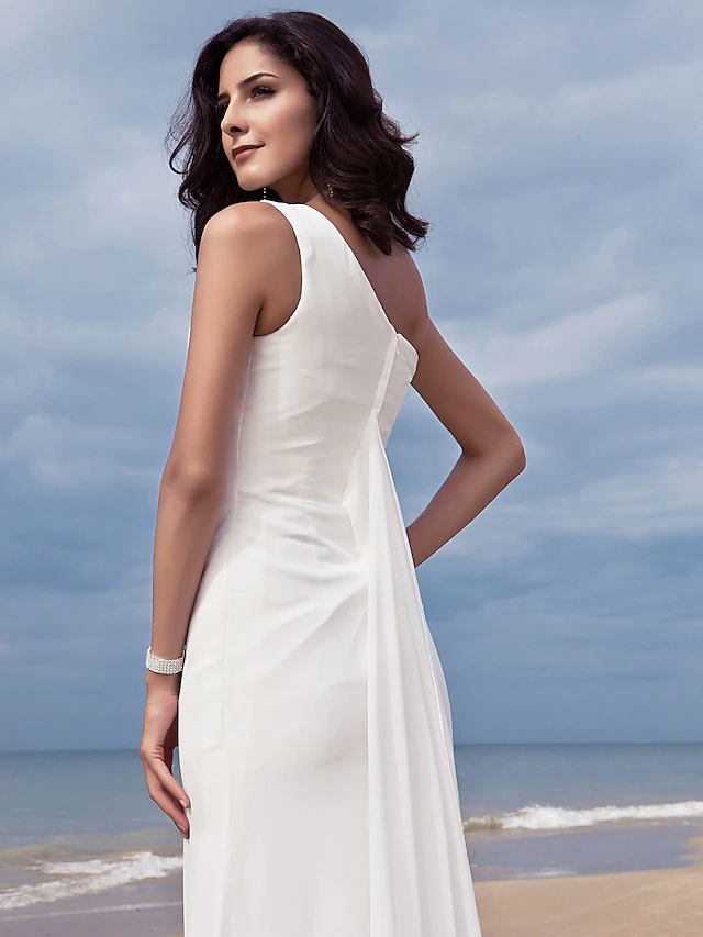 Detail of the one shoulder neckline on a chiffon bridal gown.