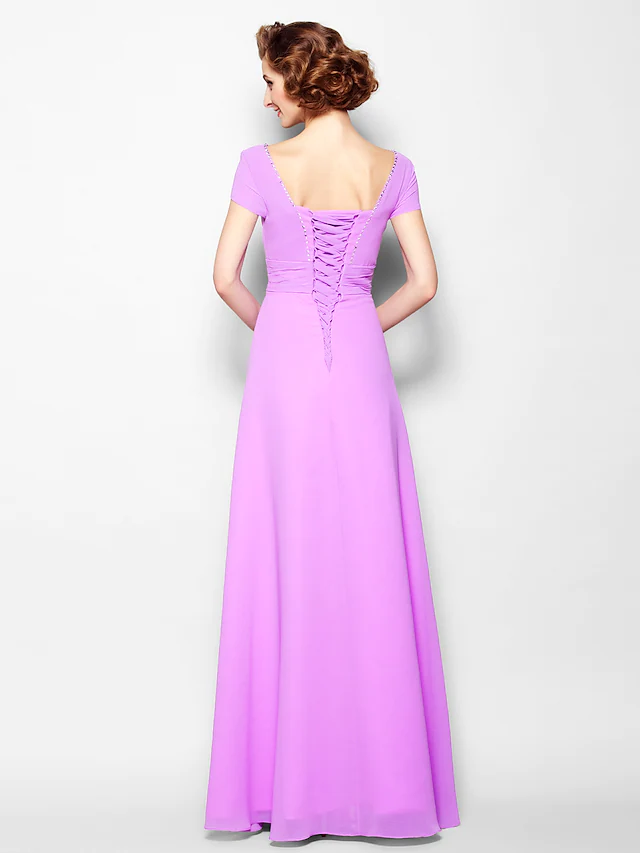 Back view of the A-line Mother of the Bride dress showing lace-up detail and floor-length skirt.