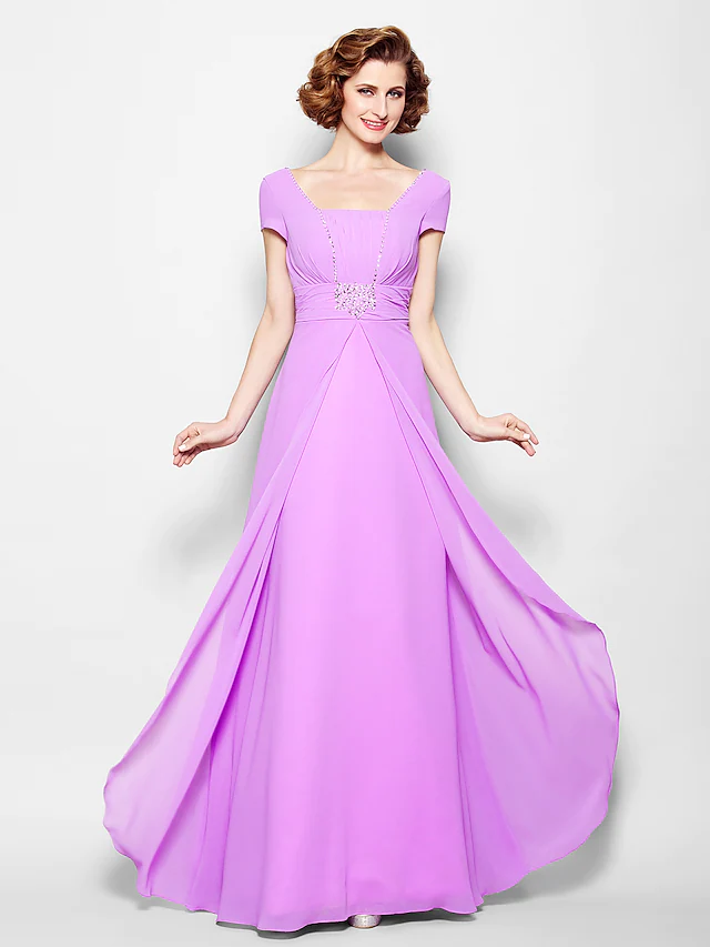 Side profile of the woman in the georgette A-line dress with ruched beading.
