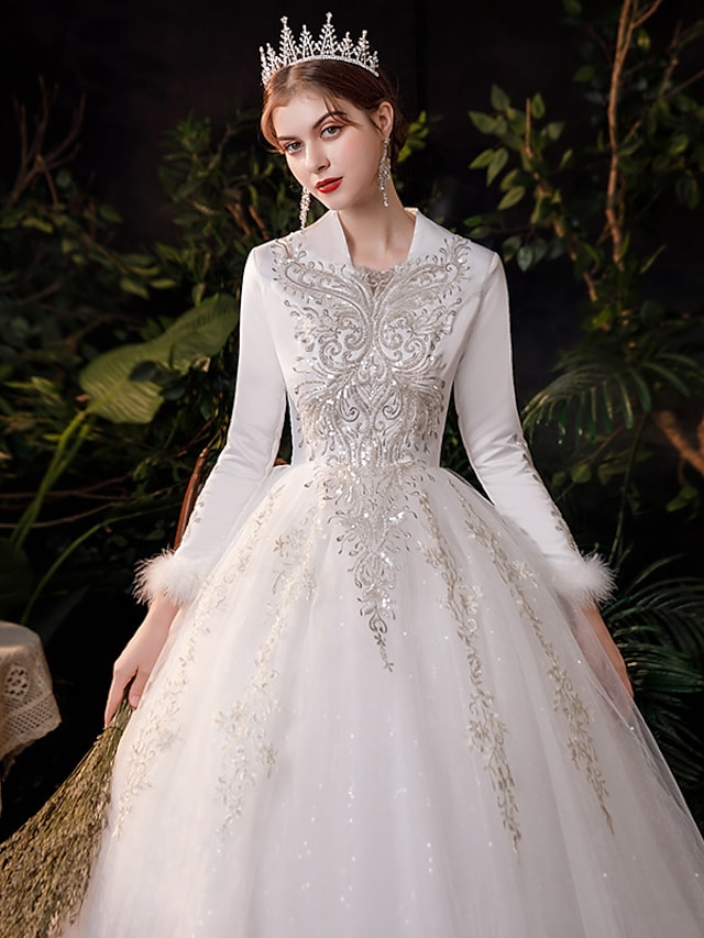 Detail of sparkling tulle and intricate appliques on the ball gown skirt.