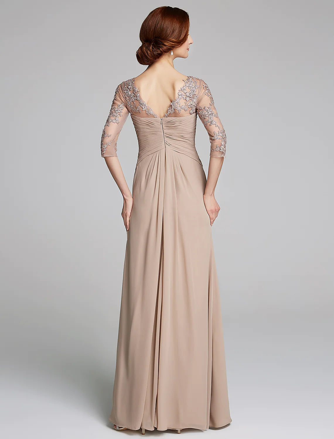 Close-up of crystal appliques on the elegant floor-length dress.