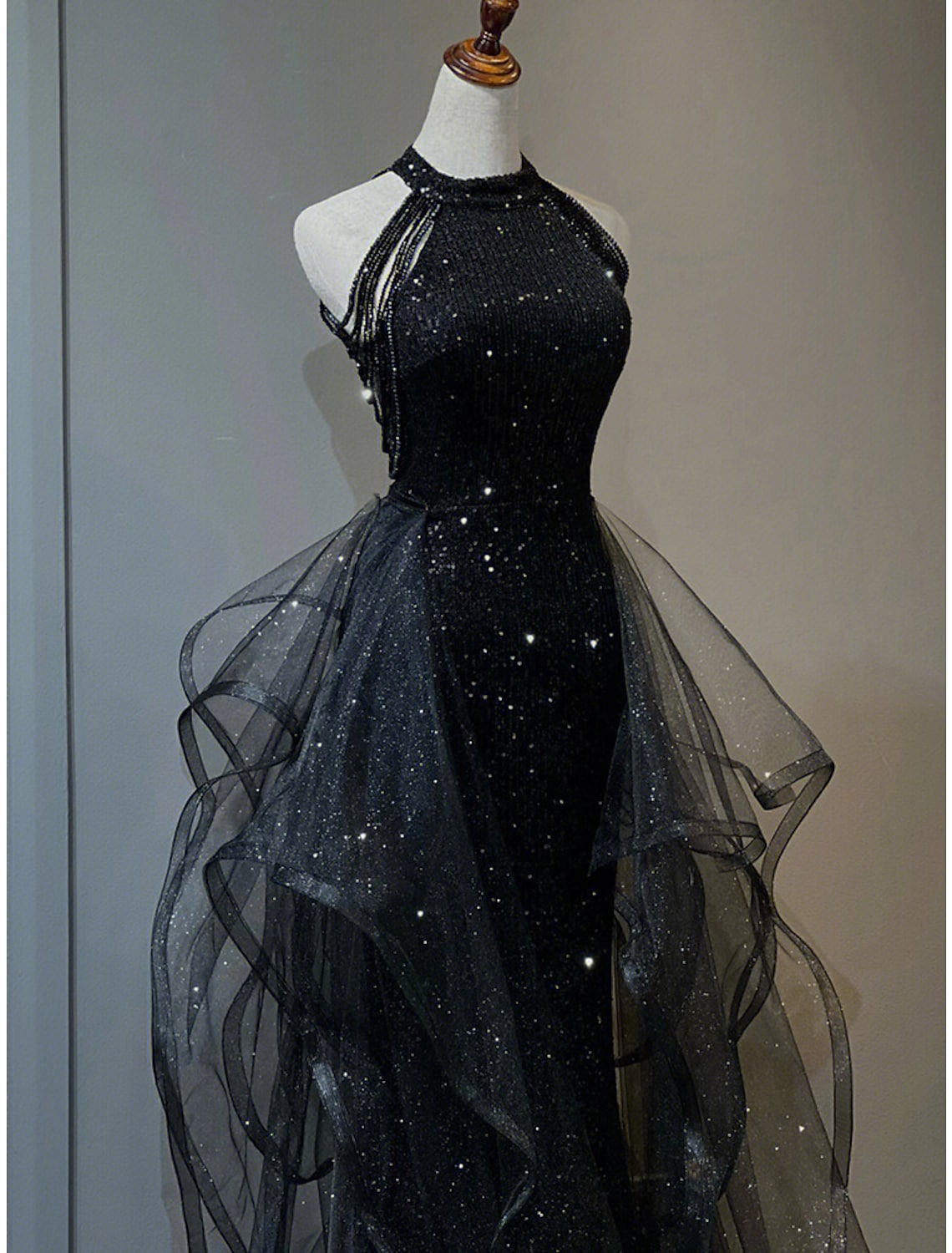 Model posing in the elegant A-Line sequined gown.