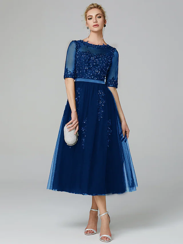 Full length view of the elegant tea length formal dress.