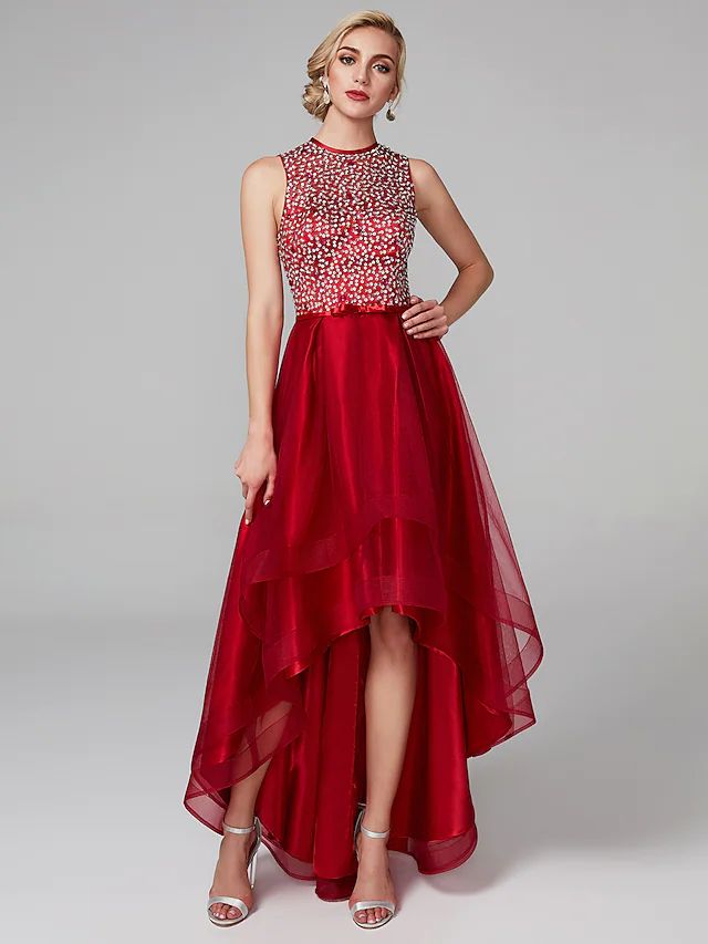 Front view of a sparkling A-line high-low sequin cocktail dress with a jewel neck.
