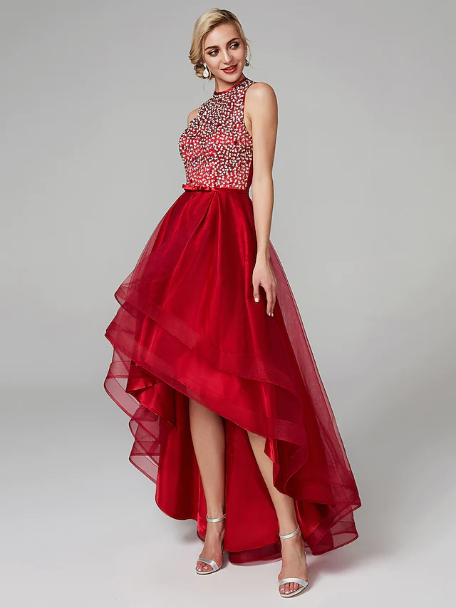 Close-up of the jewel neck and keyhole detail on the sequin dress.