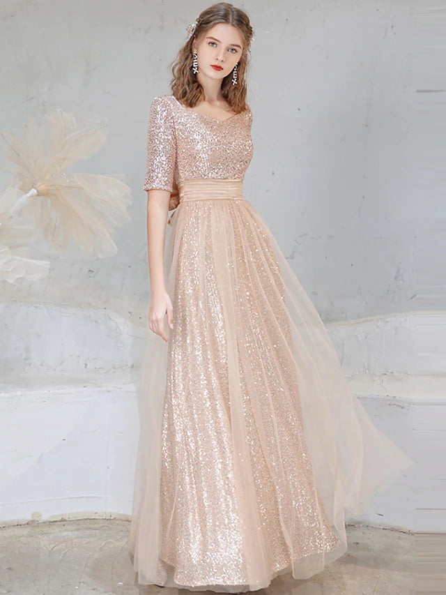 Back view of the floor-length sequined A-line gown, showcasing its elegant drape.