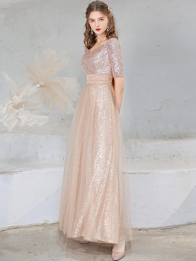 Close-up of the sequined fabric and V-neckline on the A-line evening dress.