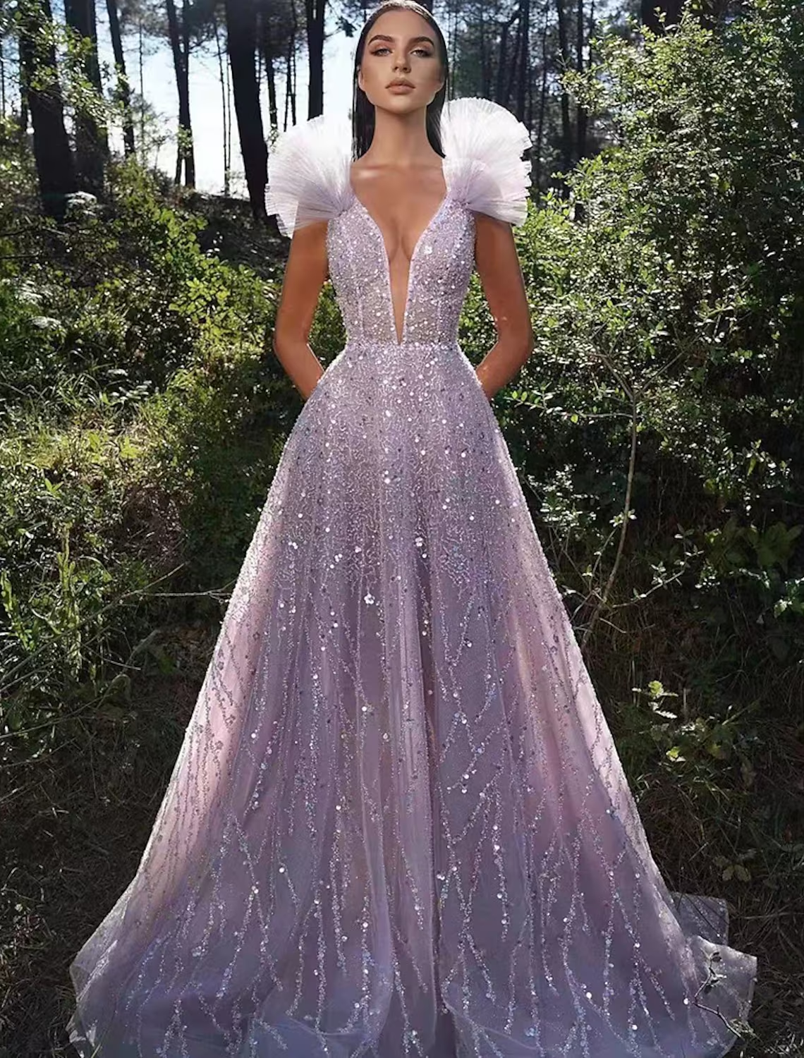 Sparkling A-line V-neck sequined floor length prom dress.