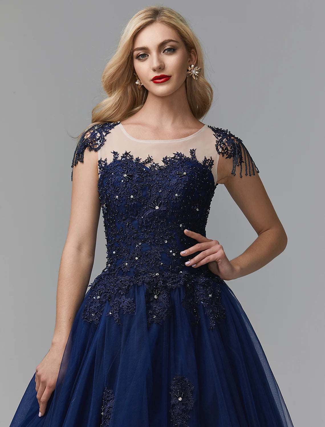 Back view of a sparkling off-shoulder long sleeve satin ball gown with chapel train.