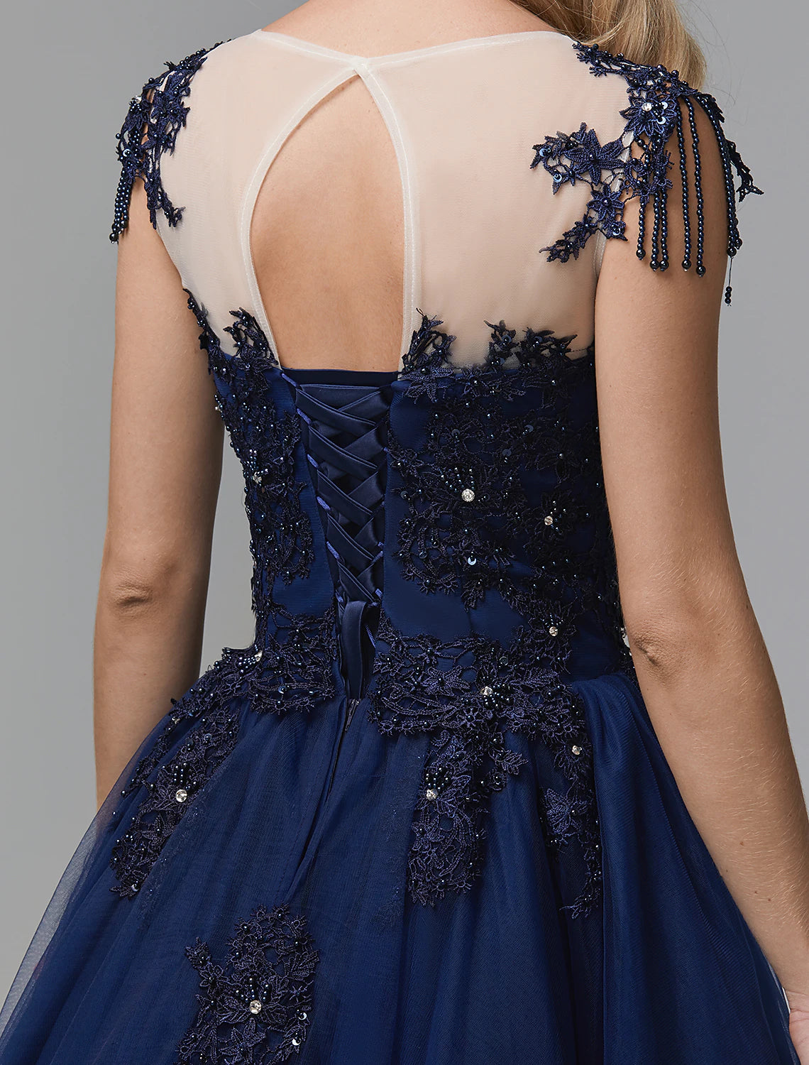 Full length view of a sparkling off-shoulder long sleeve satin quinceanera dress.