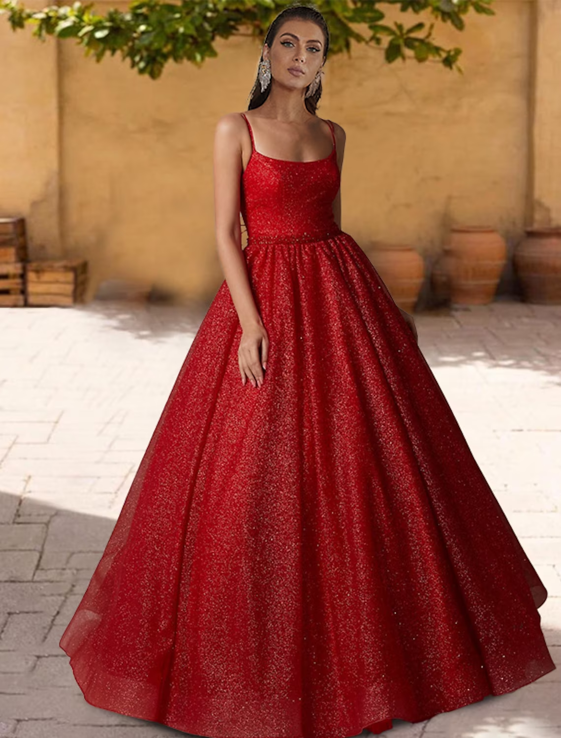 Sparkling ball gown Quinceanera dress with glitter tulle and spaghetti straps.