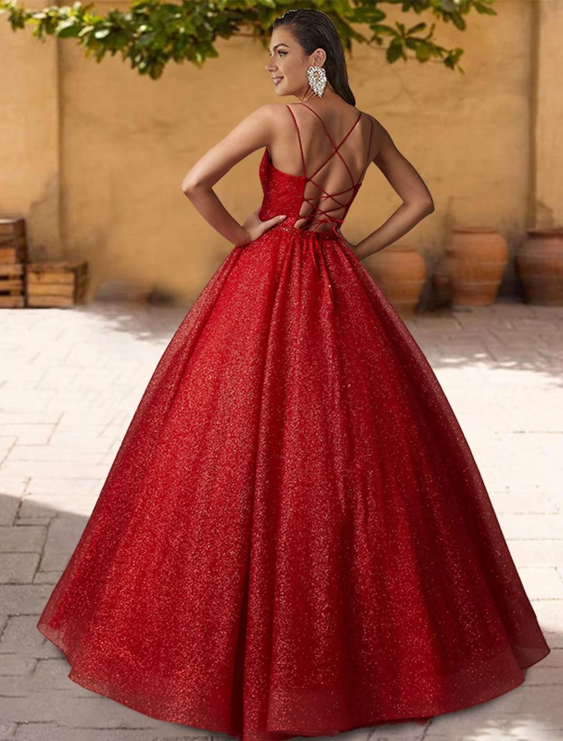 Close-up of glitter tulle fabric and criss-cross pleats on a Quinceanera dress.