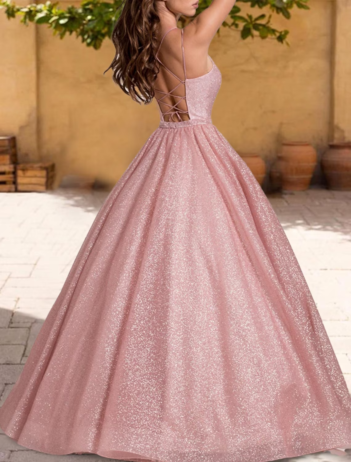 Back view of a floor-length sparkling ball gown for Sweet 16.