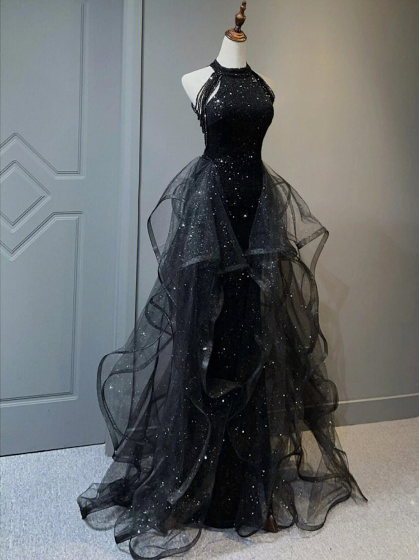 Sparkling halter sequined maxi prom dress with crystal embellishments.