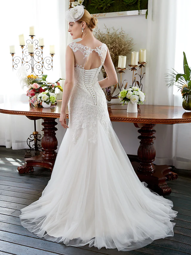 Back view of a sparkling mermaid wedding dress with court train.