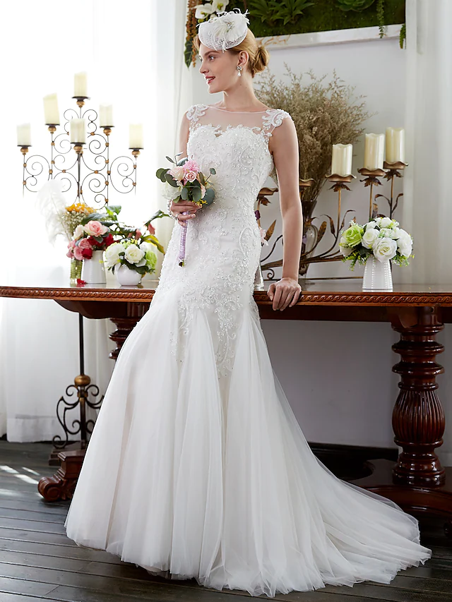 Close-up of beading appliques on an illusion neck wedding dress.