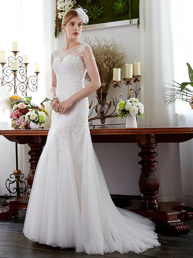 Mermaid trumpet wedding dress with a flowing court train.