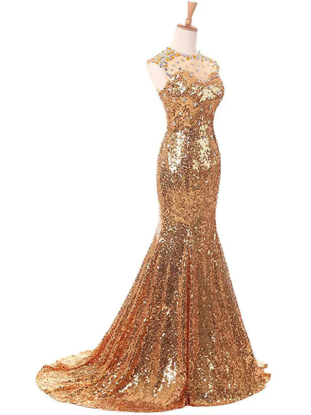 Back view of a sequined prom dress featuring a court train.