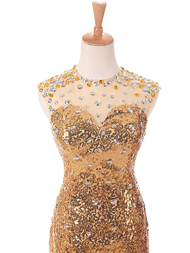 Full length view of a woman wearing a sparkling trumpet prom gown.