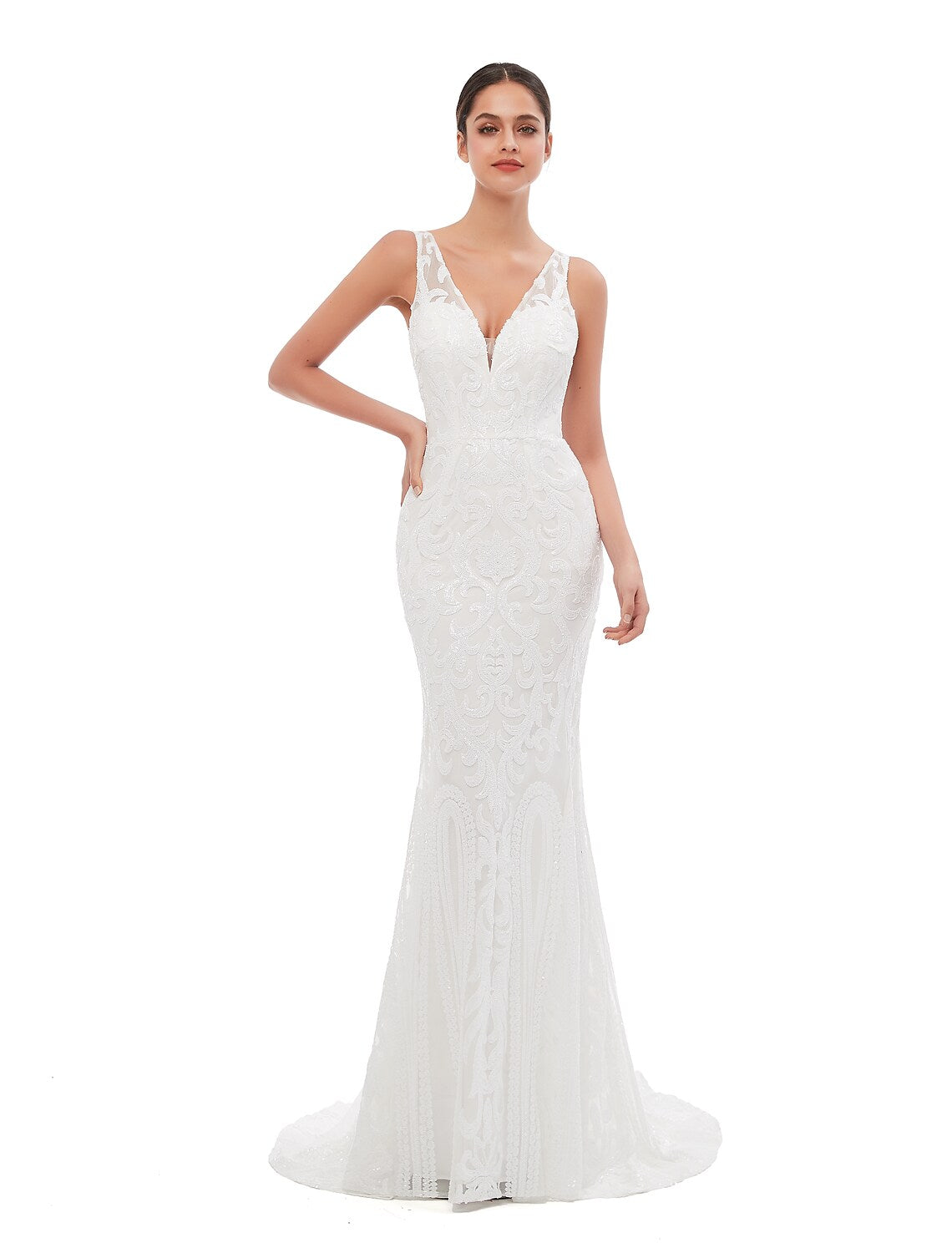 Back view of a woman in a dark blue sequined mermaid gown, showcasing the court train.