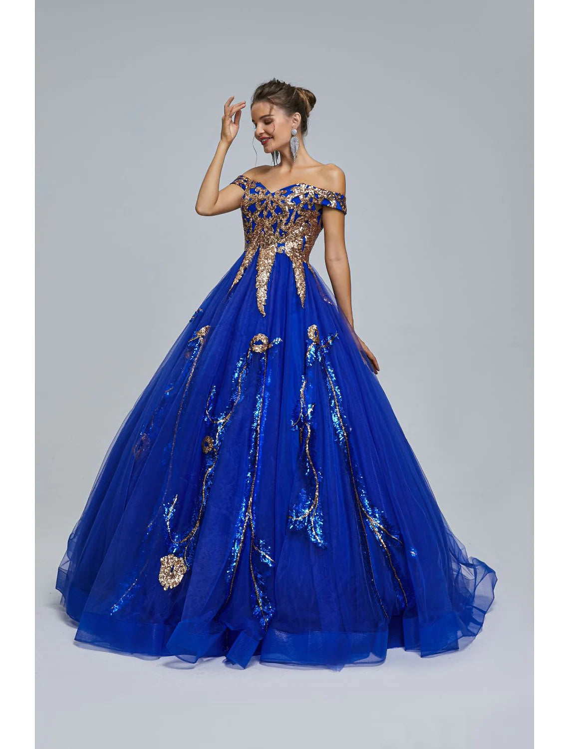 Back view of a floor-length sequin tulle prom dress.