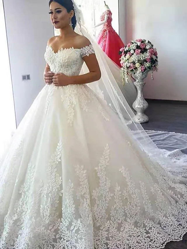 Sparkling off shoulder ball gown wedding dress with lace appliques and court train.
