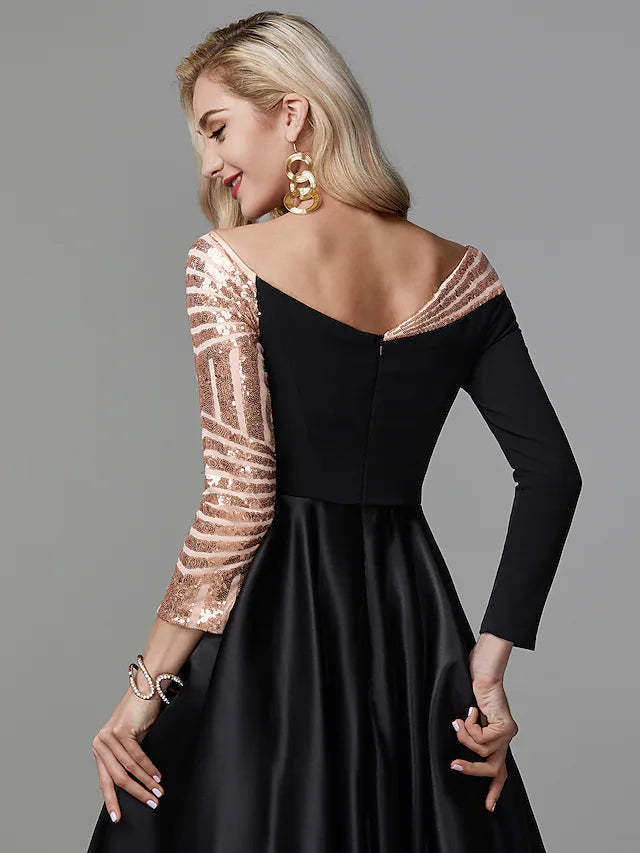 Side view of a woman wearing a floor-length off-shoulder ball gown.
