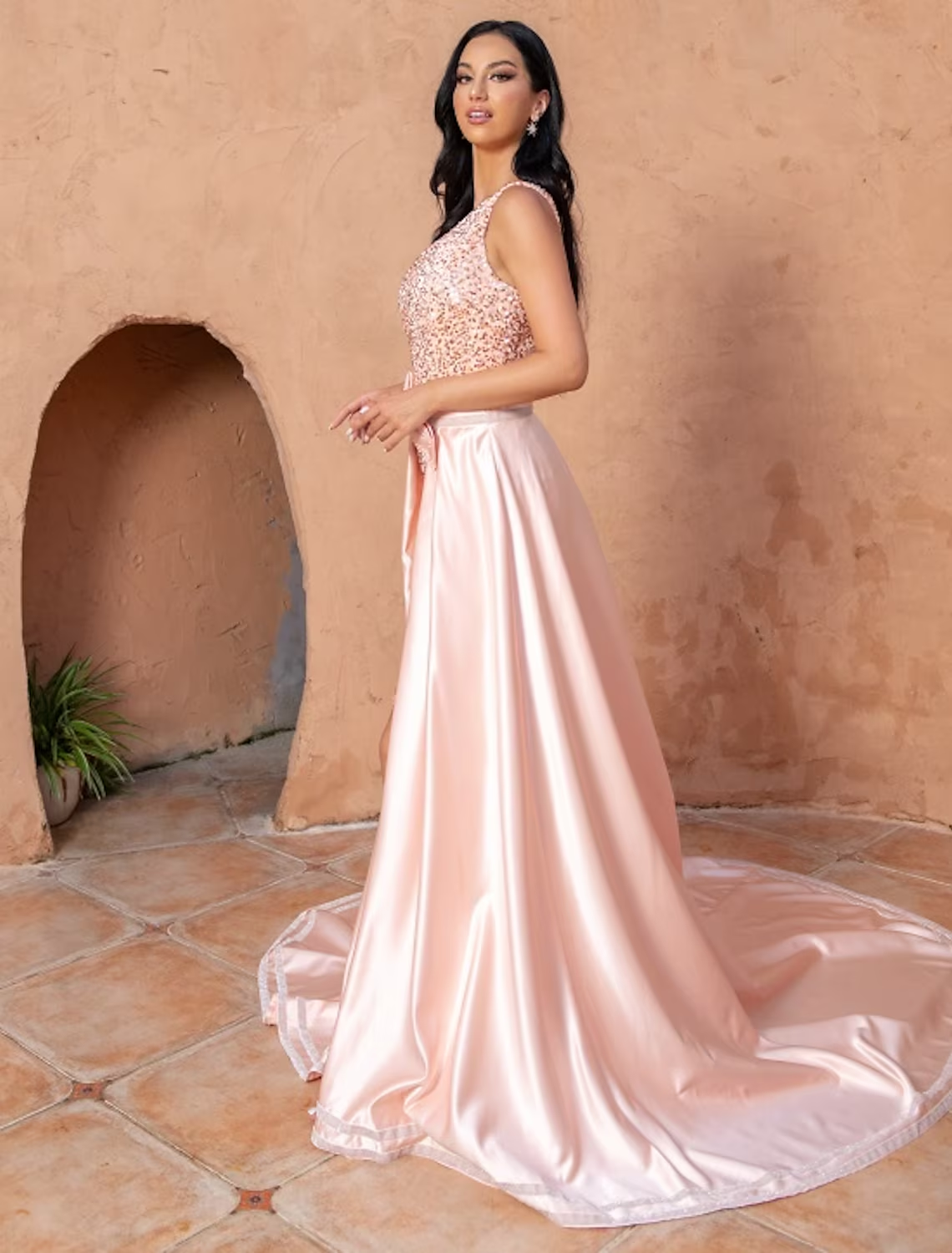 Side view of an elegant mermaid trumpet dress, highlighting the sequin details.
