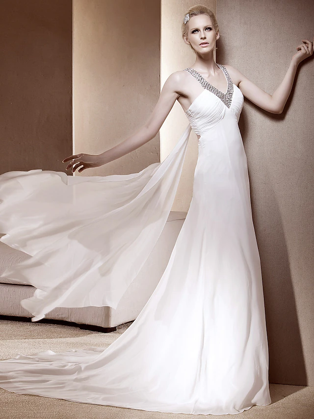 Side profile of the sleeveless chiffon wedding dress, showcasing its flowing A-Line silhouette.
