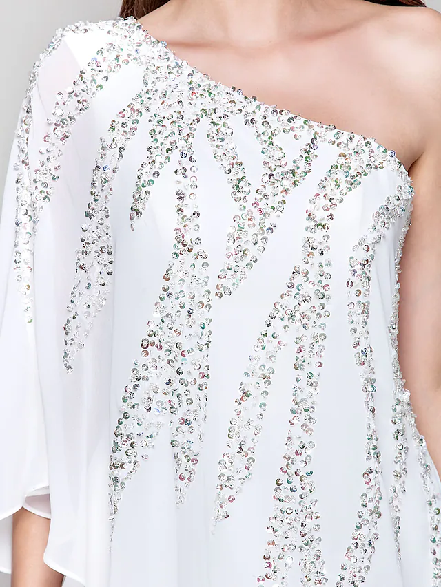Side profile of a knee-length white party dress.