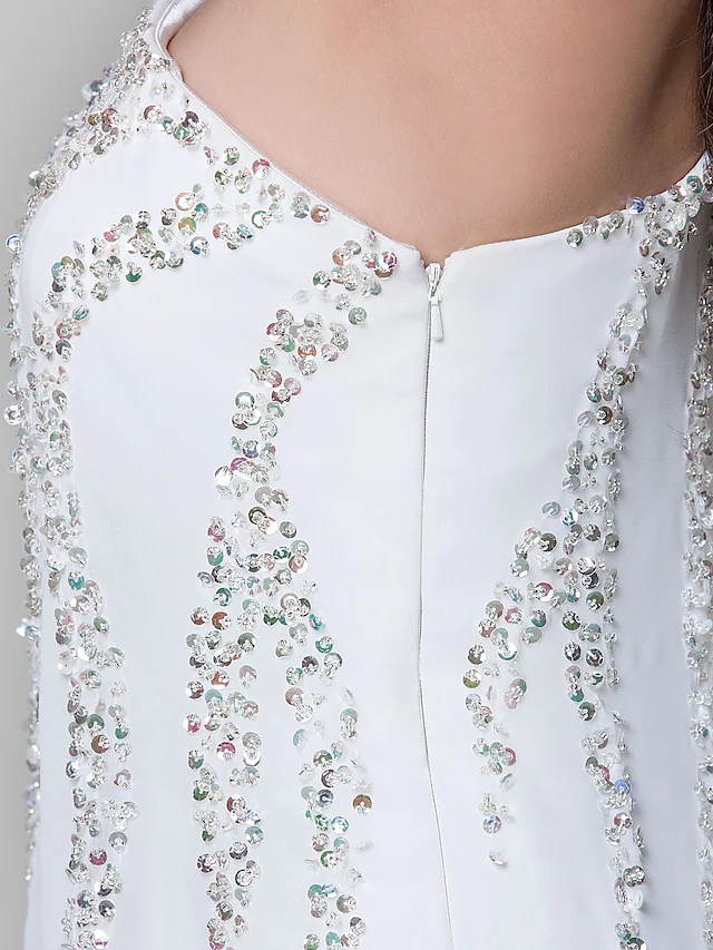 Elegant white dress for special occasions with one-shoulder design.