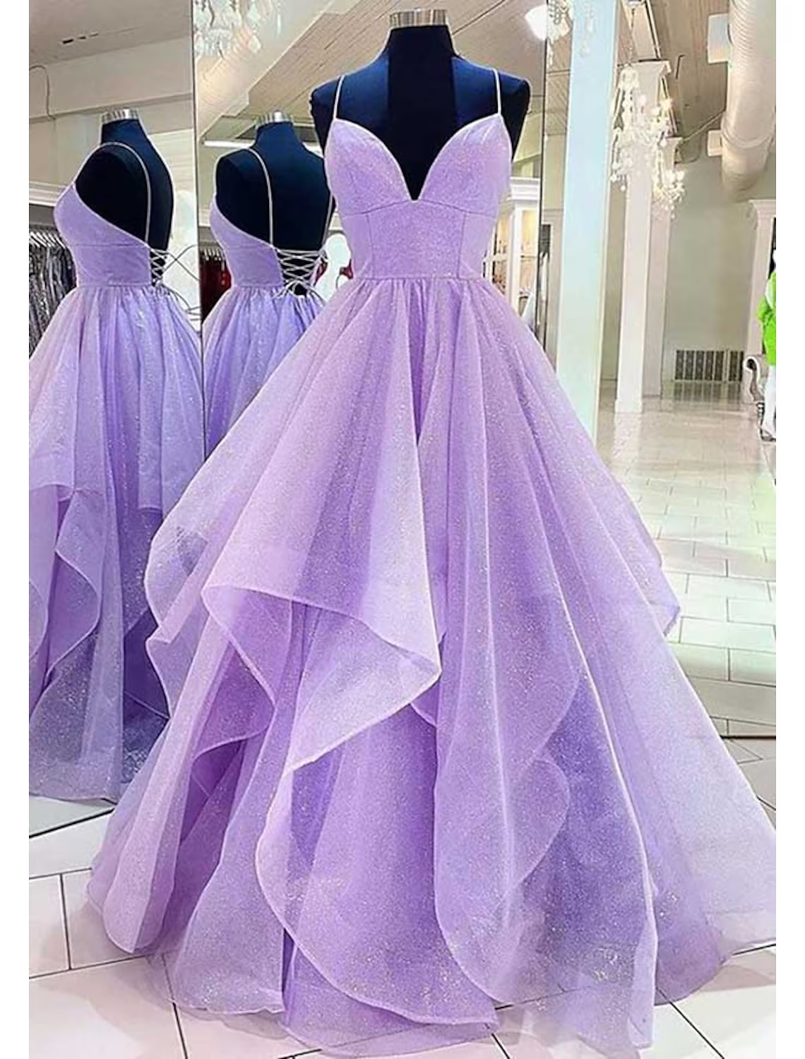 Full view of the sparkling A-line ball gown prom dress.