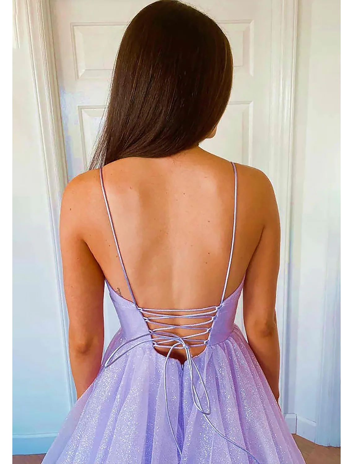 Detailed view of the sweetheart neckline and bodice of the sparkling gown.