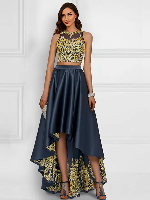 Model wearing a sparkling two-piece asymmetrical cocktail dress.