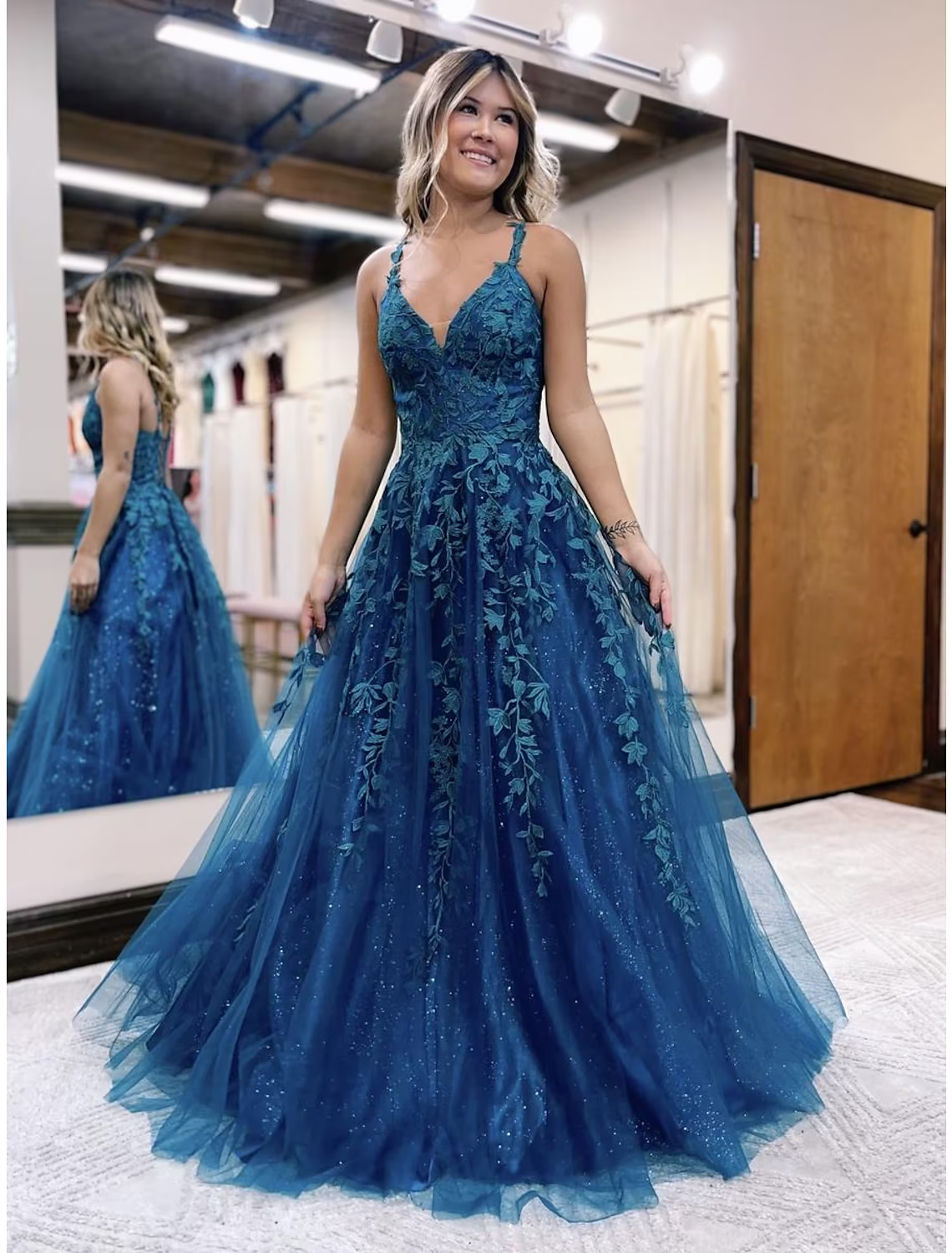 Sparkly A-line V-neck prom dress with glitter appliques.