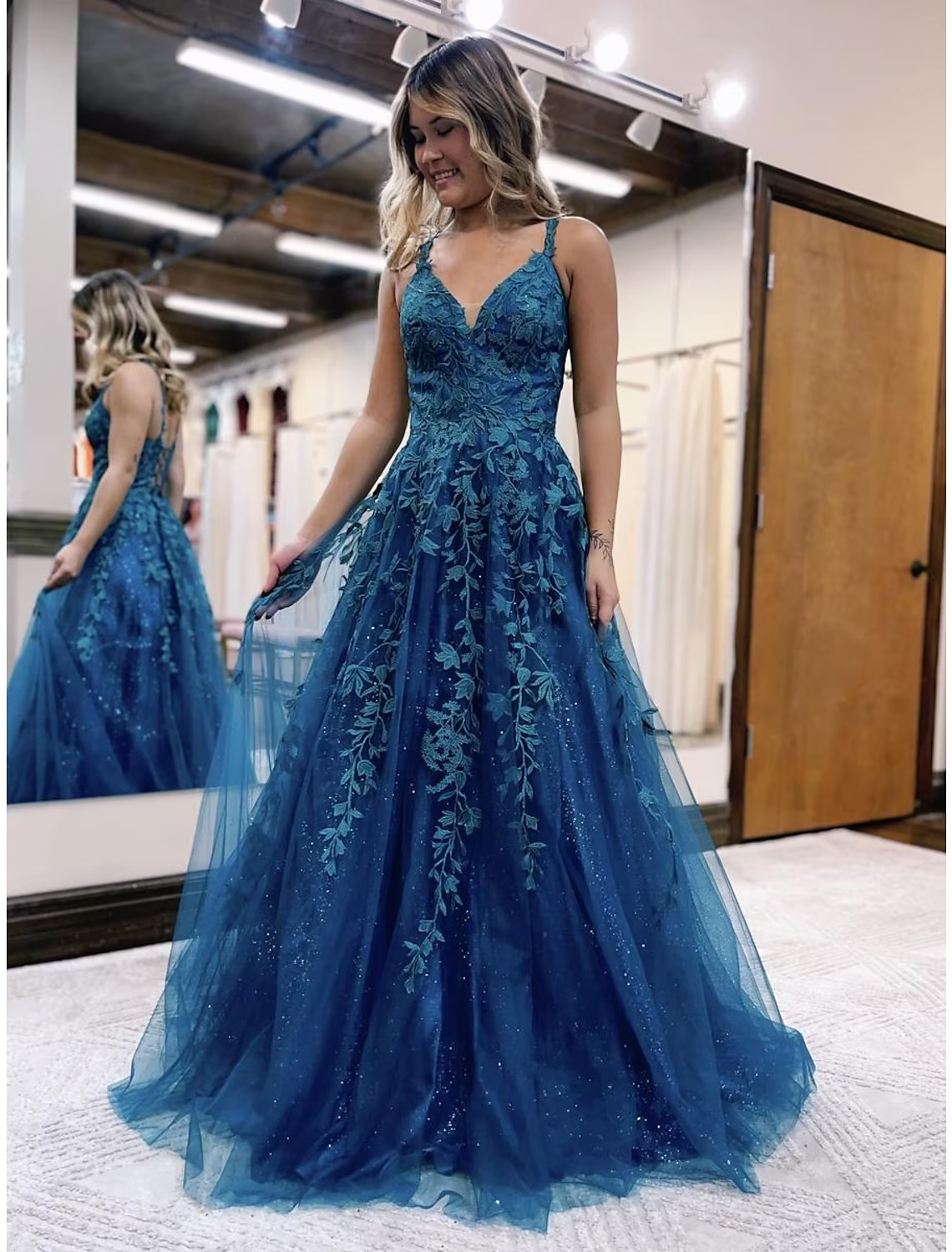 Glitter appliques on the tulle fabric of a formal dress.