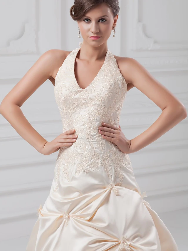 Side view of A-line wedding dress with pick-up skirt and regular straps.