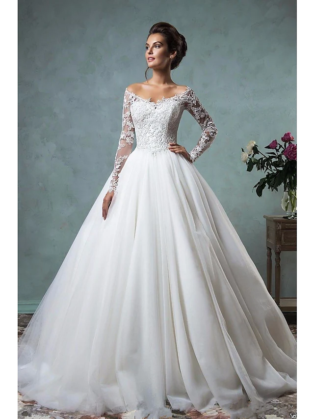 Elegant A-Line wedding dress with off-shoulder neckline and long lace sleeves.