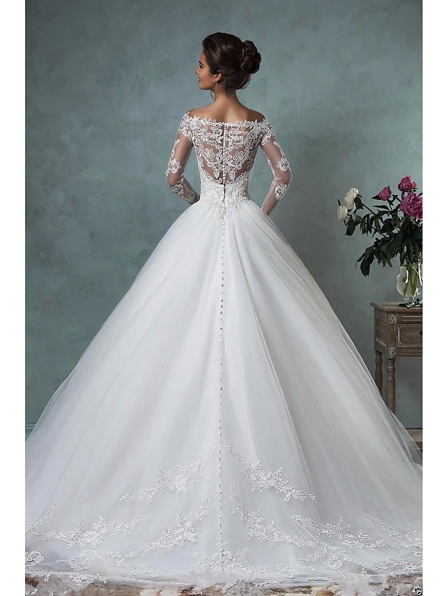 Romantic A-Line wedding dress featuring a court train and delicate embroidery.