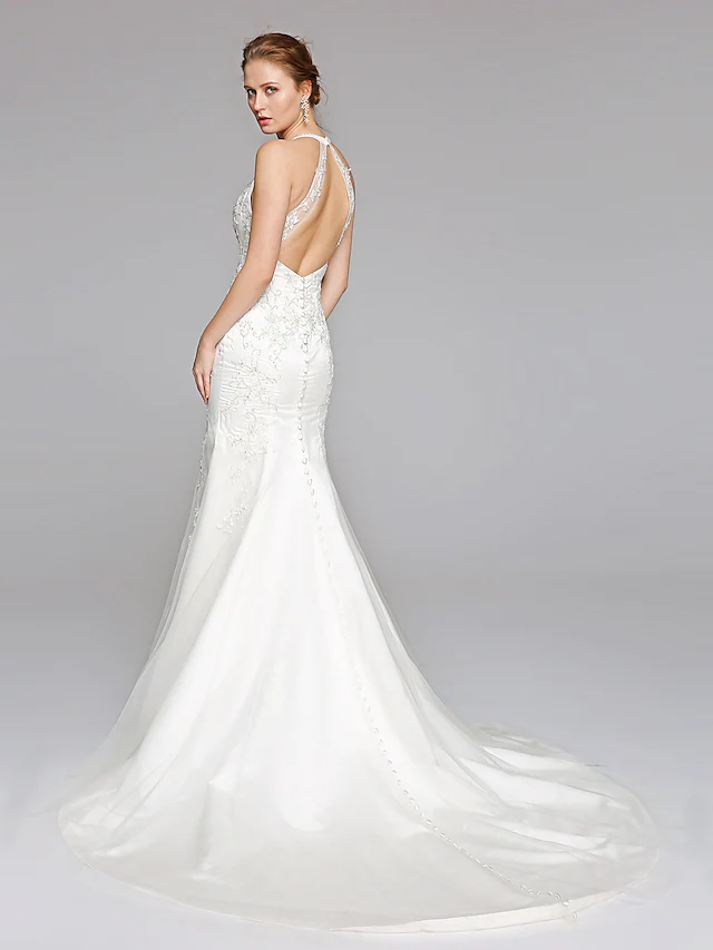 Back view of a halter neck mermaid wedding dress with illusion lace detail.