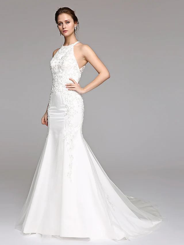 Close-up of the lace and illusion back on a wedding dress.