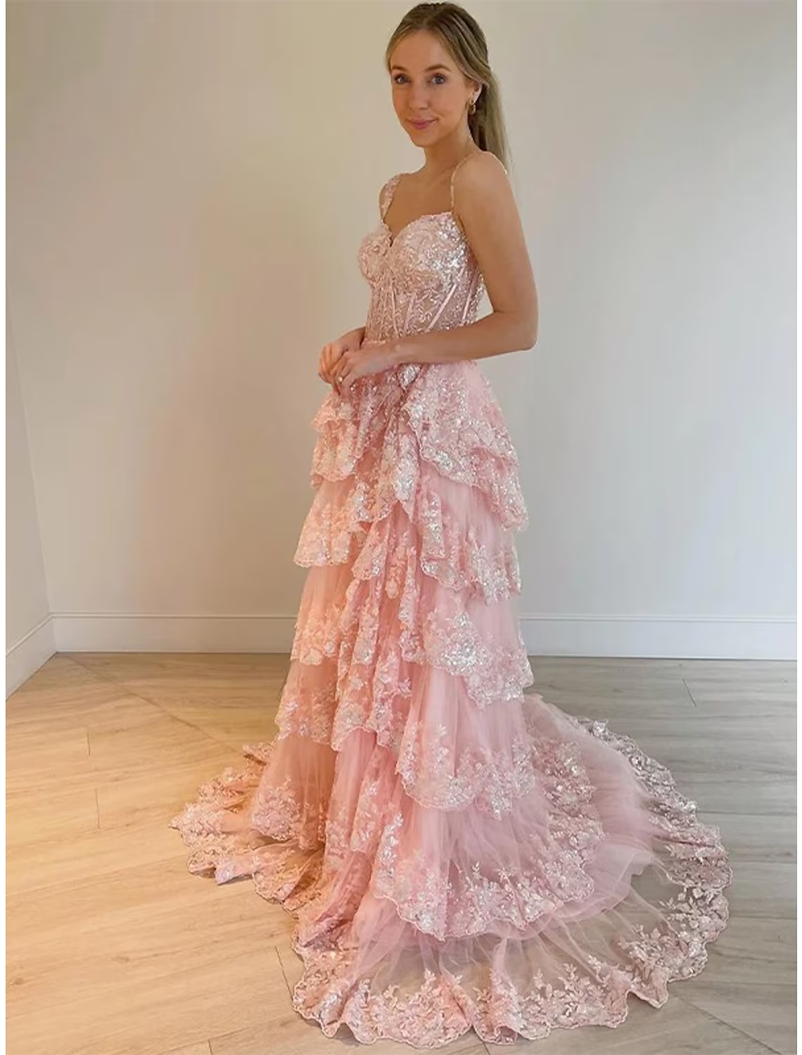 Pink mermaid trumpet prom dress with off-shoulder neckline and sequin slit.
