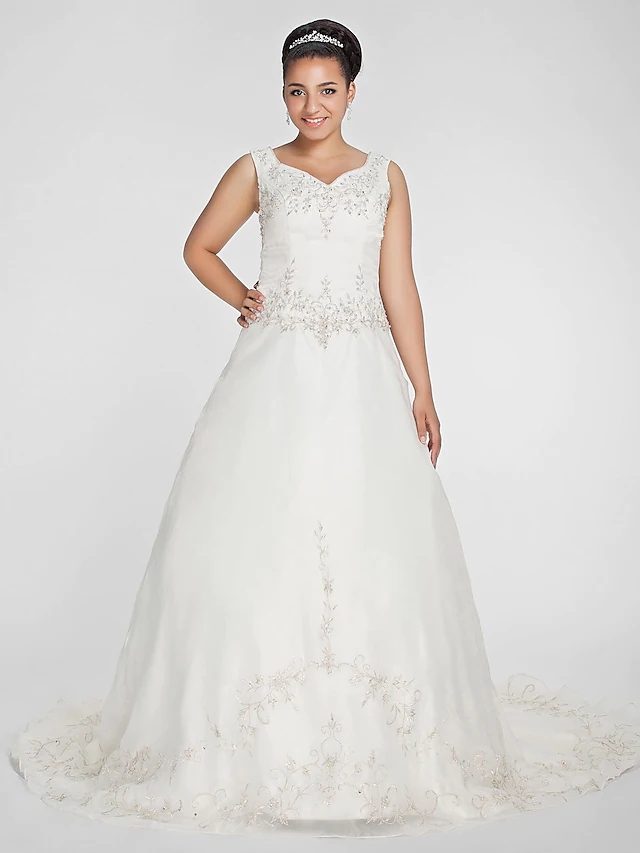Plus size ball gown wedding dress with V-neck and regular straps.