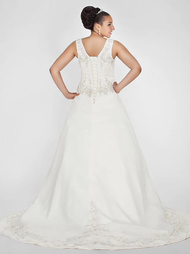 Back view of elegant ball gown wedding dress with court train.