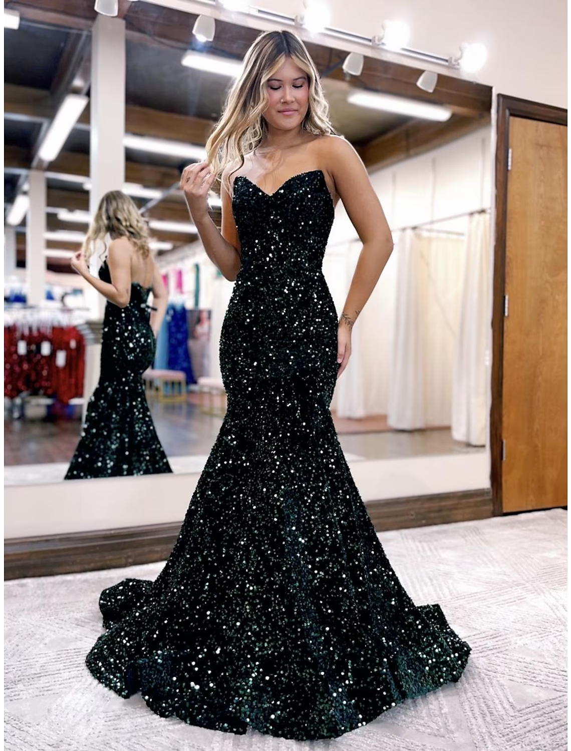 Close-up of the sequin detail on the blue mermaid trumpet prom dress.