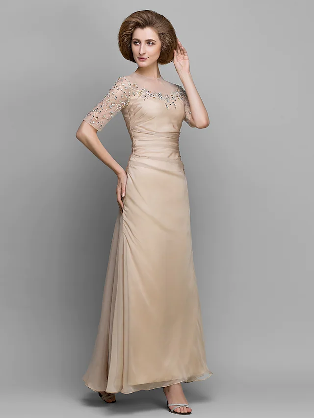 A-Line mother of the bride dress with jewel neck, half sleeves, and ruched beading.