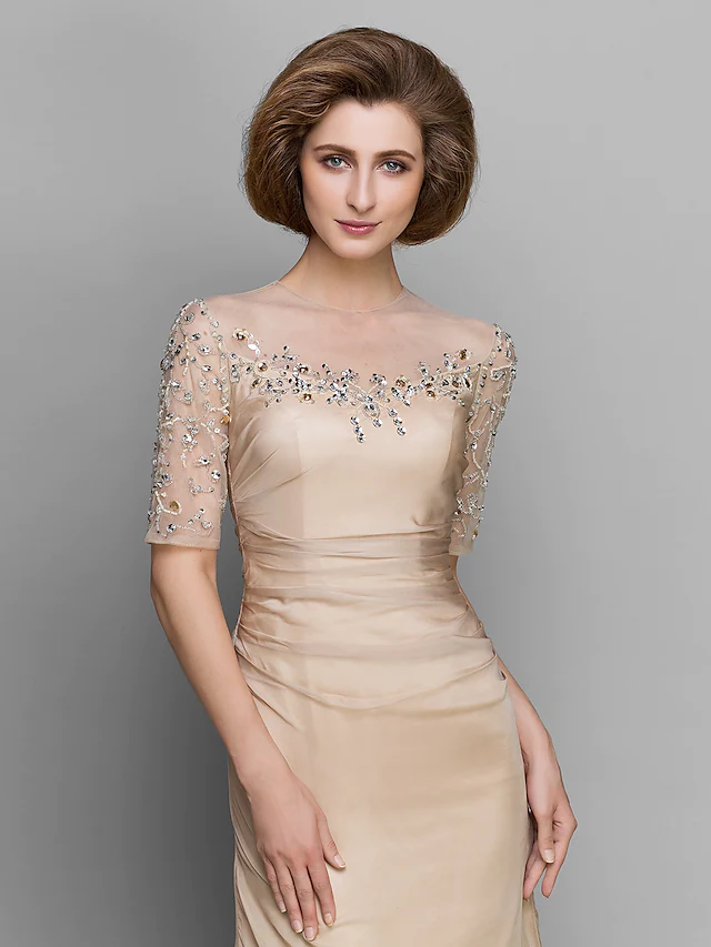 Close-up of the jewel neck and ruched bodice with beading.